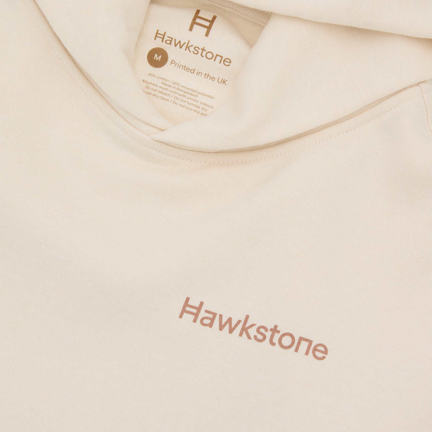 Beige Hoodie with 'Hawkstone' branding.