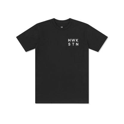 Black t-shirt with 'HWK STN' text on a white background 