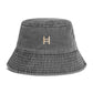 Gray bucket hat with a logo on a white background 